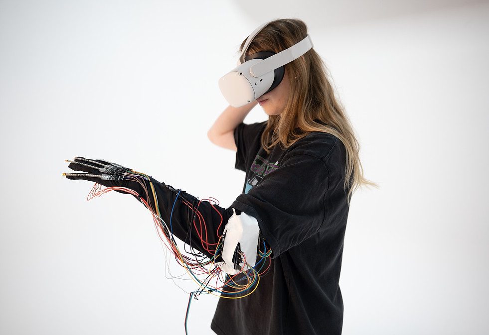 User testing the Extended MetaMeditation wearable glove and VR experience